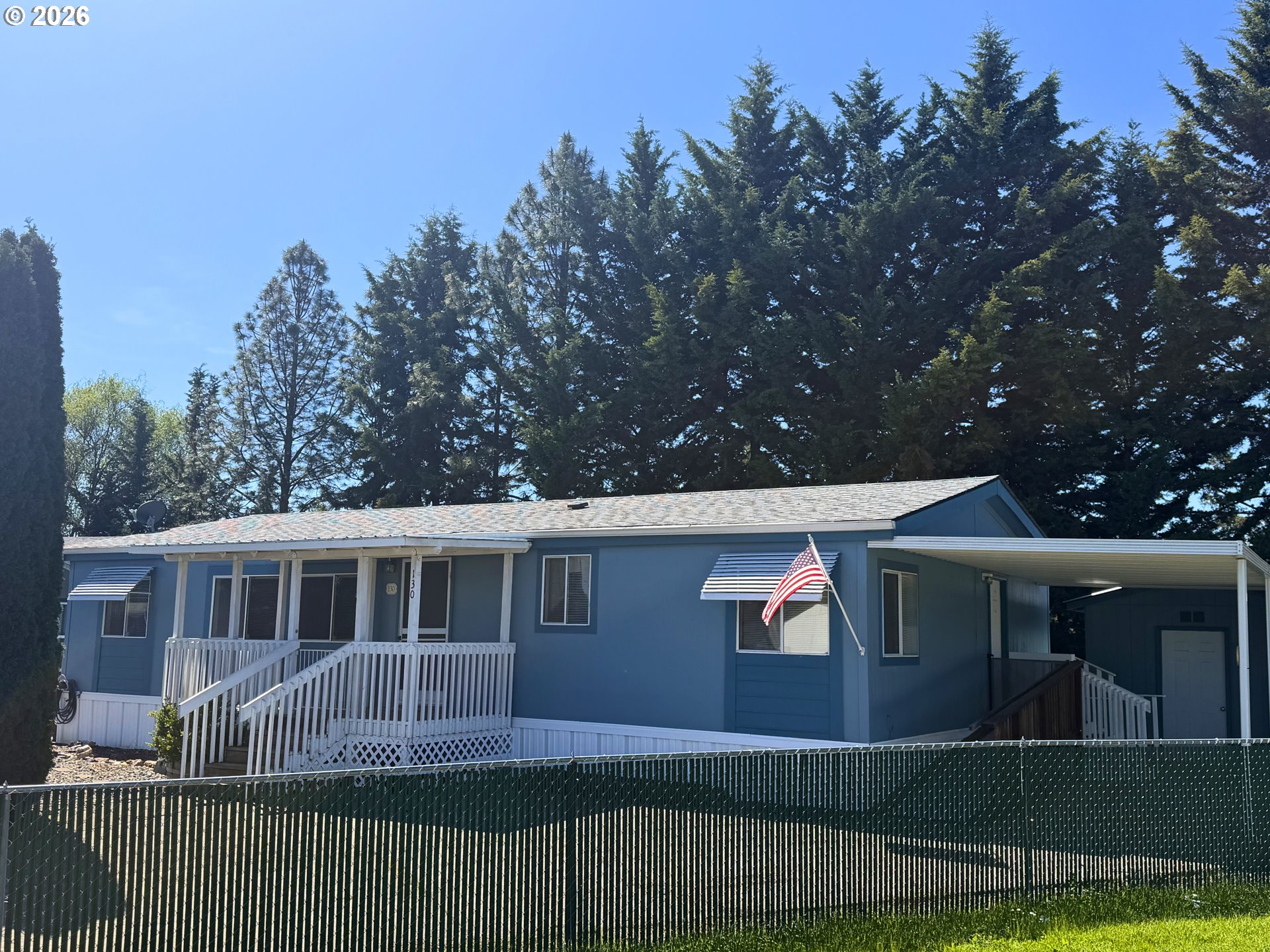 130 Stephanie Court Winston, OR 97496 - Photo 1 of 22 a front view of a house with a garden
