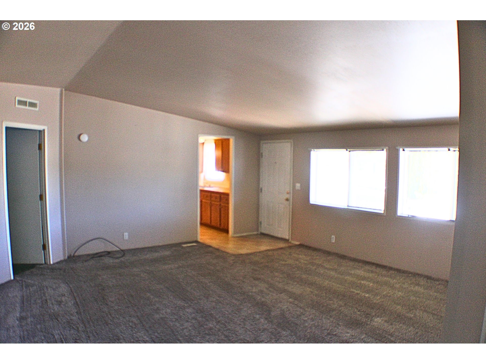 130 Stephanie Court Winston, OR 97496 - Photo 4 of 22 a view of an empty room and window