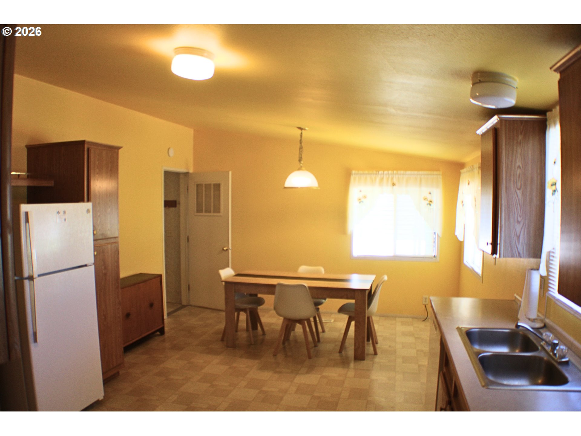 130 Stephanie Court Winston, OR 97496 - Photo 5 of 22 a view of a dining area with furniture and a chandelier