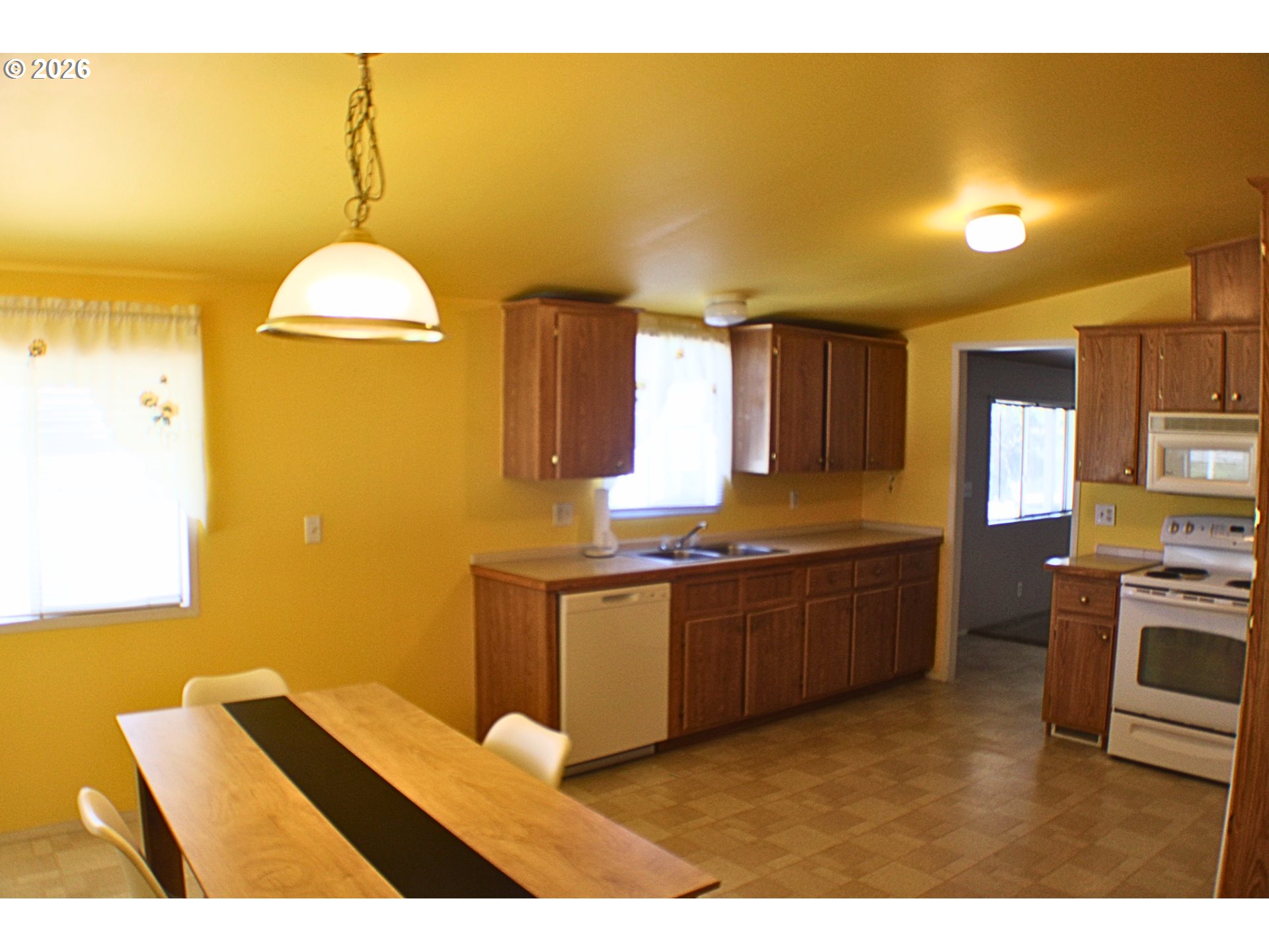 130 Stephanie Court Winston, OR 97496 - Photo 6 of 22 a kitchen with stainless steel appliances granite countertop a sink cabinets and wooden floor