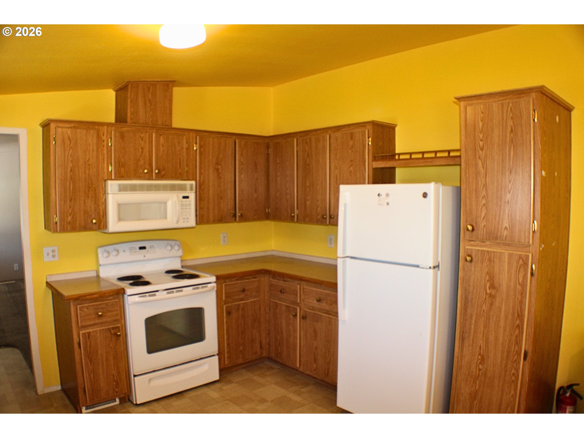 130 Stephanie Court Winston, OR 97496 - Photo 9 of 22 a view of kitchen and utility room with washer and dryer