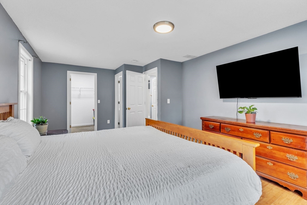 44 Border Street Springfield, MA 01104 - Photo 19 of 37 a bedroom with a bed and a flat screen tv