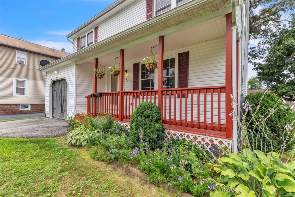 44 Border Street Springfield, MA 01104 - Photo 2 of 37 a front view of a house with a garden