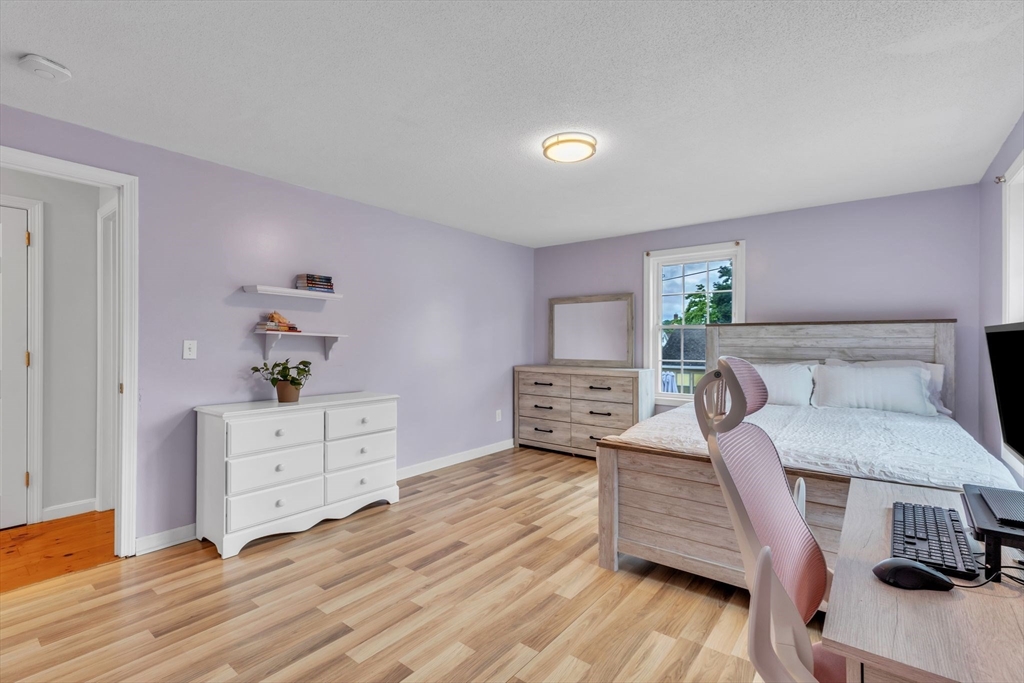 44 Border Street Springfield, MA 01104 - Photo 23 of 37 a room with furniture and wooden floor