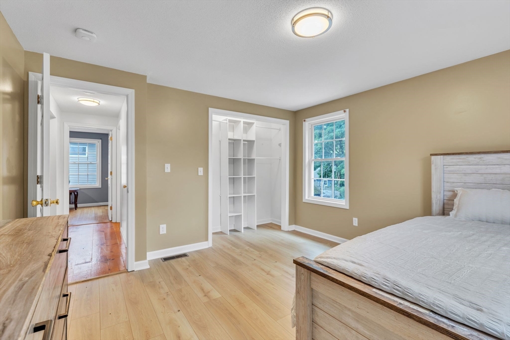 44 Border Street Springfield, MA 01104 - Photo 25 of 37 a bedroom with a bed and a large window