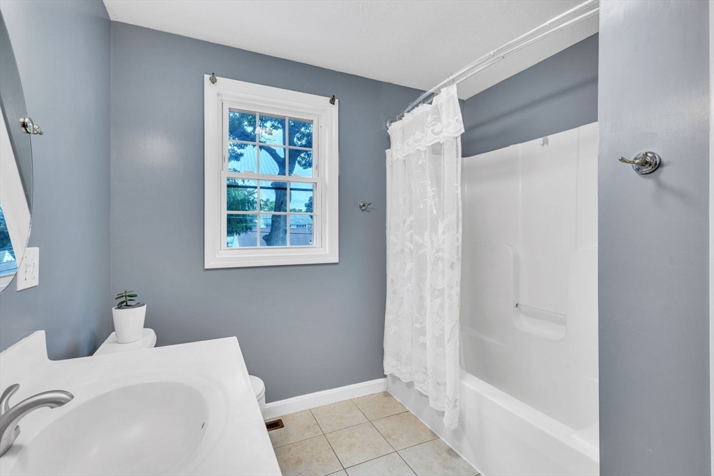 44 Border Street Springfield, MA 01104 - Photo 30 of 37 a bathroom with a sink and a bathtub