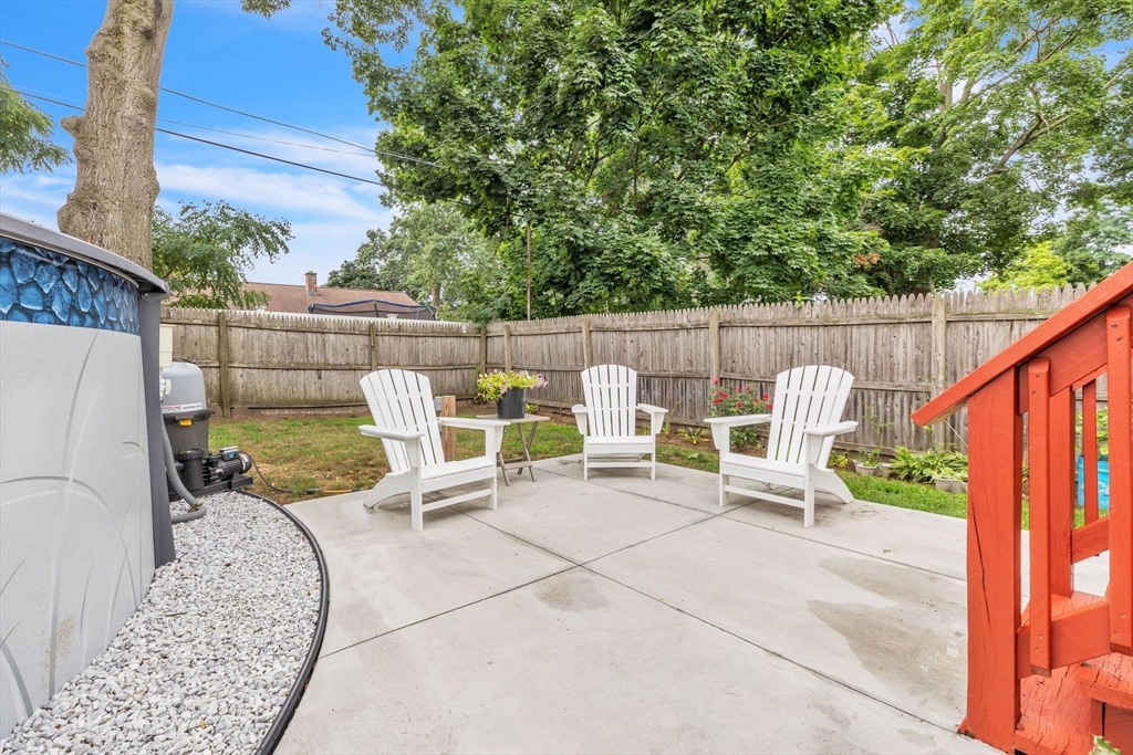 44 Border Street Springfield, MA 01104 - Photo 35 of 37 a view of a patio with couches chairs and wooden fence