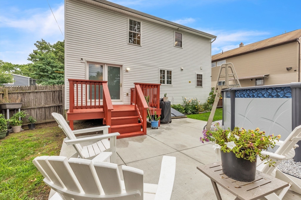 44 Border Street Springfield, MA 01104 - Photo 36 of 37 a chairs and a table in the patio with a backyard