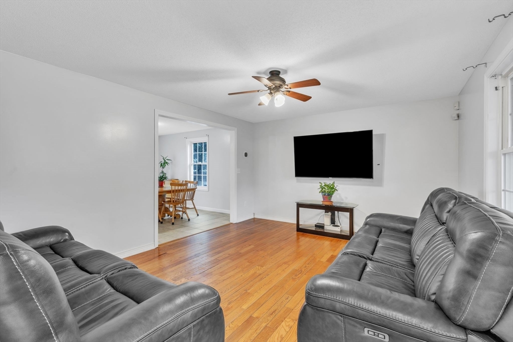 44 Border Street Springfield, MA 01104 - Photo 5 of 37 a living room with furniture and a flat screen tv