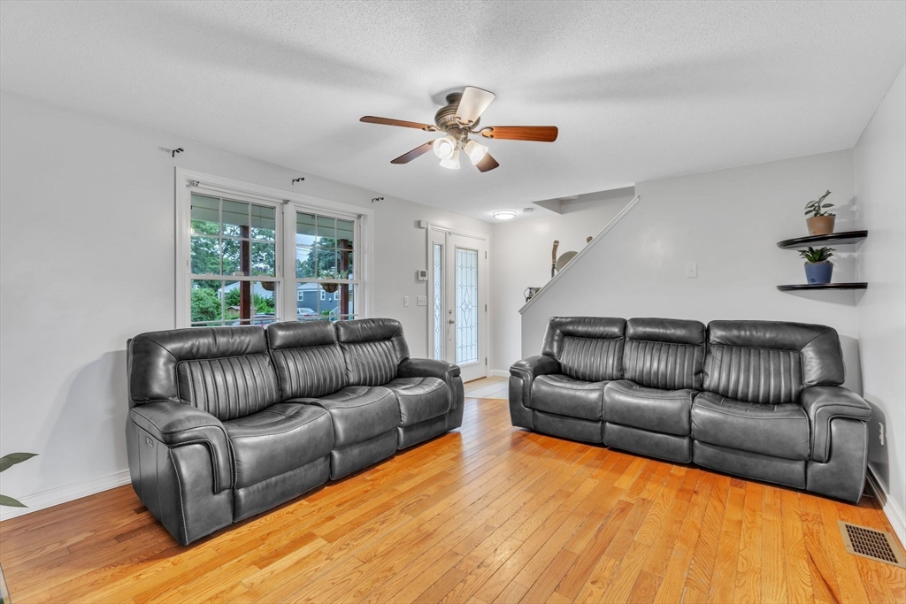 44 Border Street Springfield, MA 01104 - Photo 6 of 37 a living room with furniture and a large window