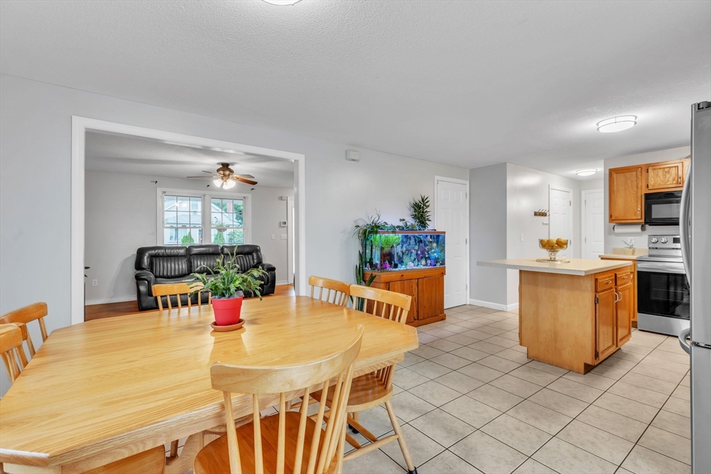 44 Border Street Springfield, MA 01104 - Photo 10 of 37 a view of kitchen with furniture and wooden floor
