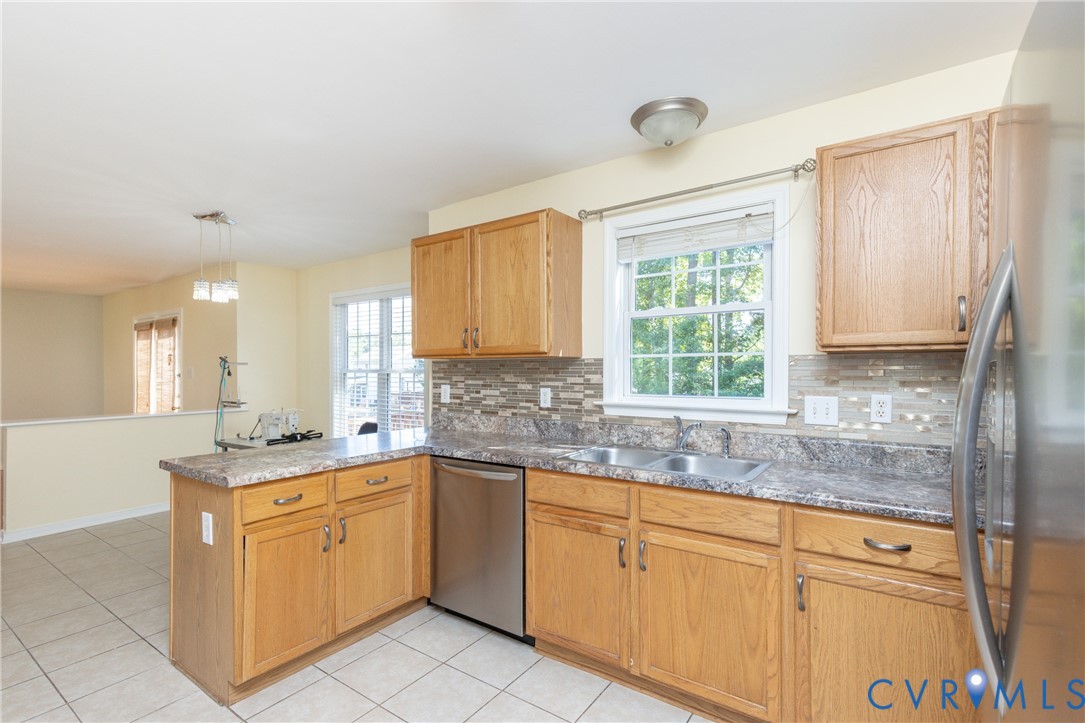 5101 Spring Bluff Road Midlothian, VA 23112 - Photo 17 of 47 Kitchen featuring tile flooring, light wood cabine