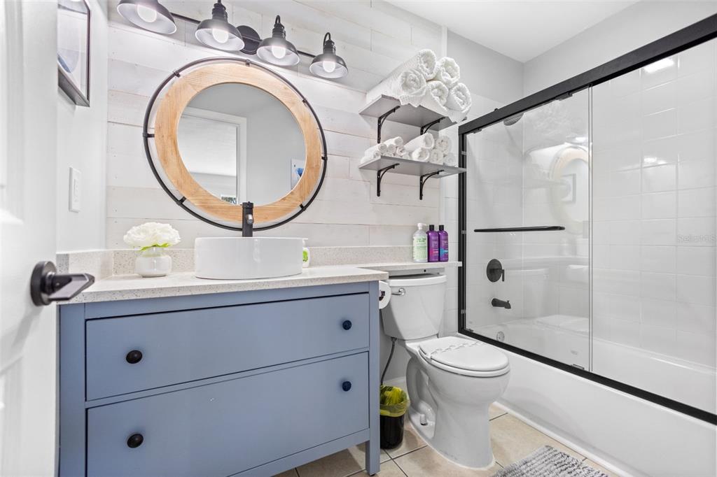 3443 Clark Road, Unit 242 Sarasota, FL 34231 - Photo 14 of 21 a bathroom with a toilet a sink and mirror