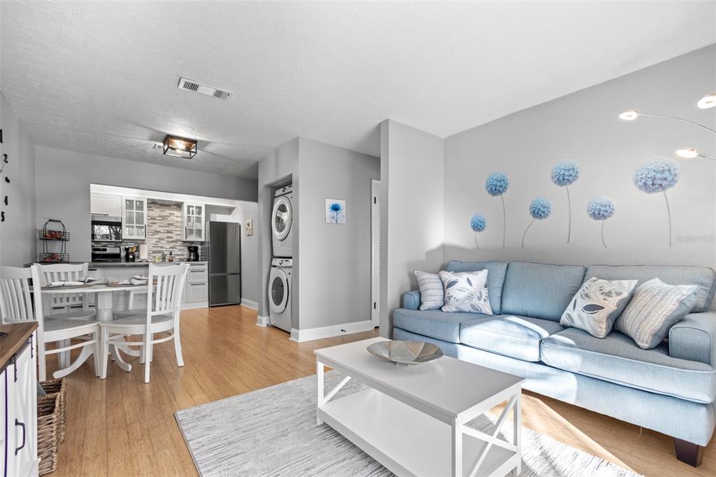 3443 Clark Road, Unit 242 Sarasota, FL 34231 - Photo 3 of 21 a living room with furniture and wooden floor