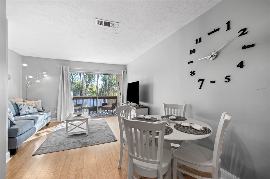 3443 Clark Road, Unit 242 Sarasota, FL 34231 - Photo 4 of 21 a view of a dining room with furniture window and outside view