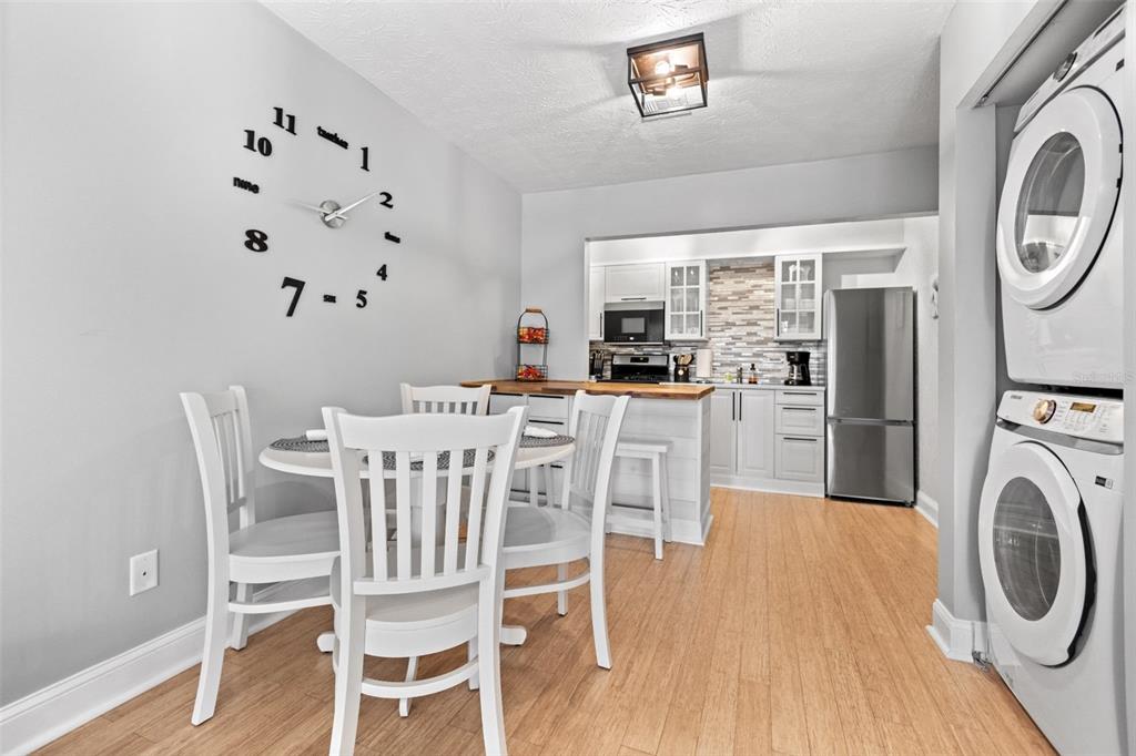 3443 Clark Road, Unit 242 Sarasota, FL 34231 - Photo 9 of 21 a view of a dining room with furniture window and wooden floor