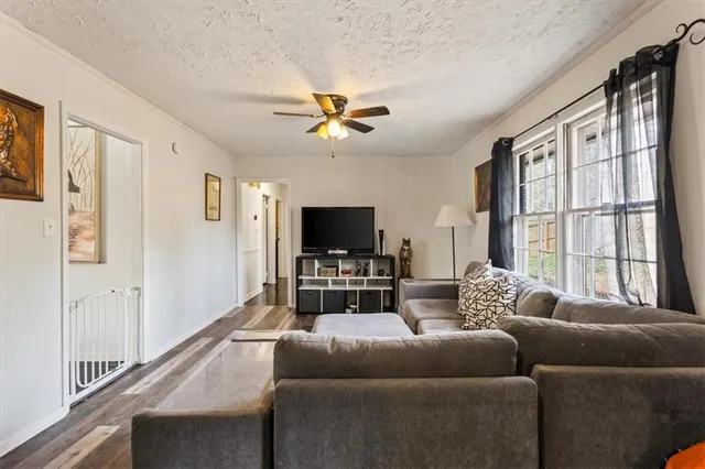 a bedroom with a bed and a chair