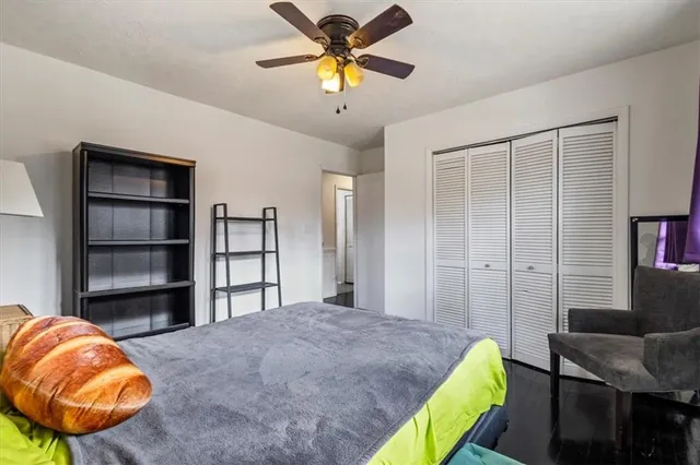 a view of a room with wooden floor and cabinet