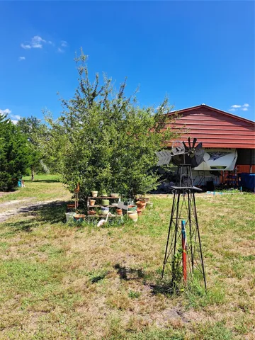 a view of swimming pool with a yard