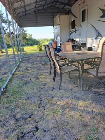 a view of a swimming pool with a yard