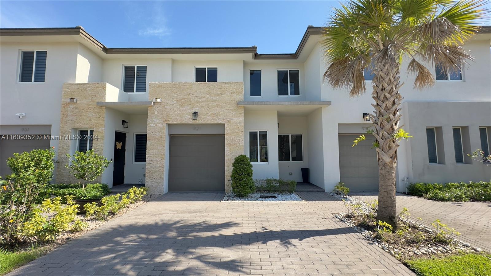 921 Pioneer Way Royal Palm Beach, FL 33411 - Photo 1 of 71 a front view of a house with a yard and garage