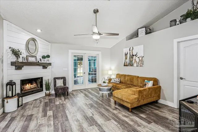 a living room with furniture and a fireplace