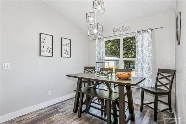 a bedroom with a bed and chair