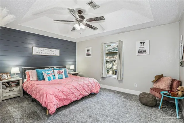 a bedroom with a bed and cabinets