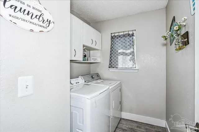 a bathroom with a sink a toilet and shower curtain