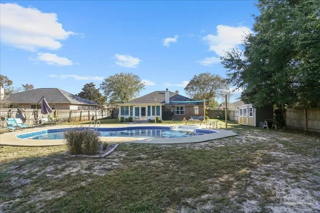 a view of a swimming pool with lounge chair