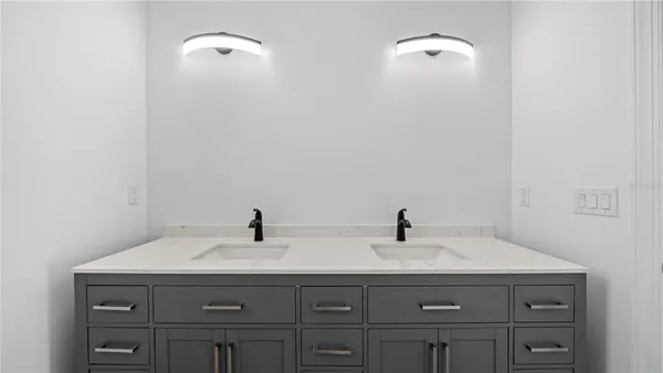 a bathroom with a sink and vanity