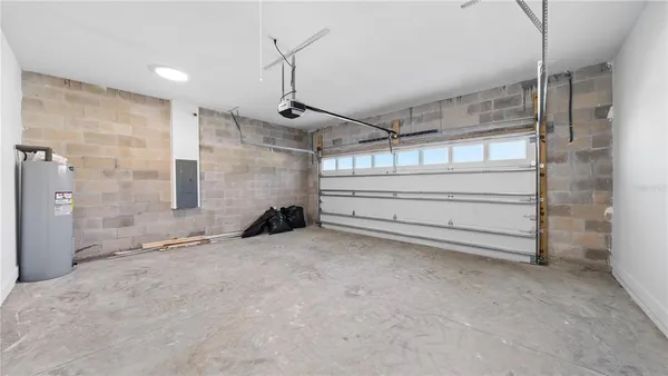 a kitchen with stainless steel appliances granite countertop a stove microwave and refrigerator