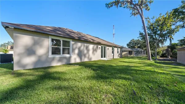 a view of backyard with a garden and plants