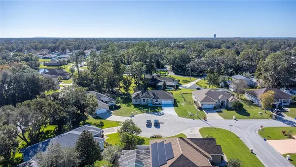 a kitchen with kitchen island granite countertop a sink cabinets and stainless steel appliances