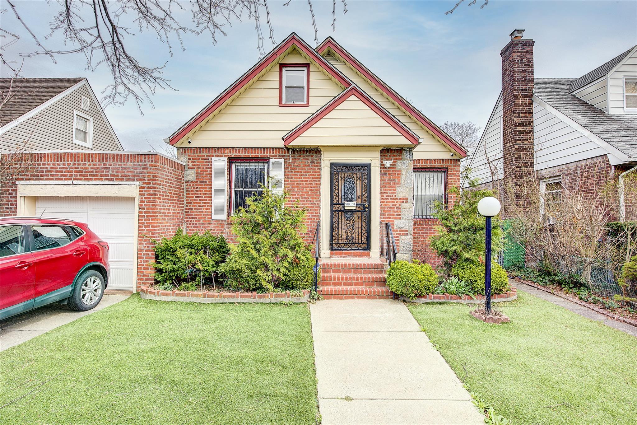 a front view of a house with garden