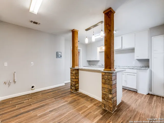 a kitchen with a sink and large window