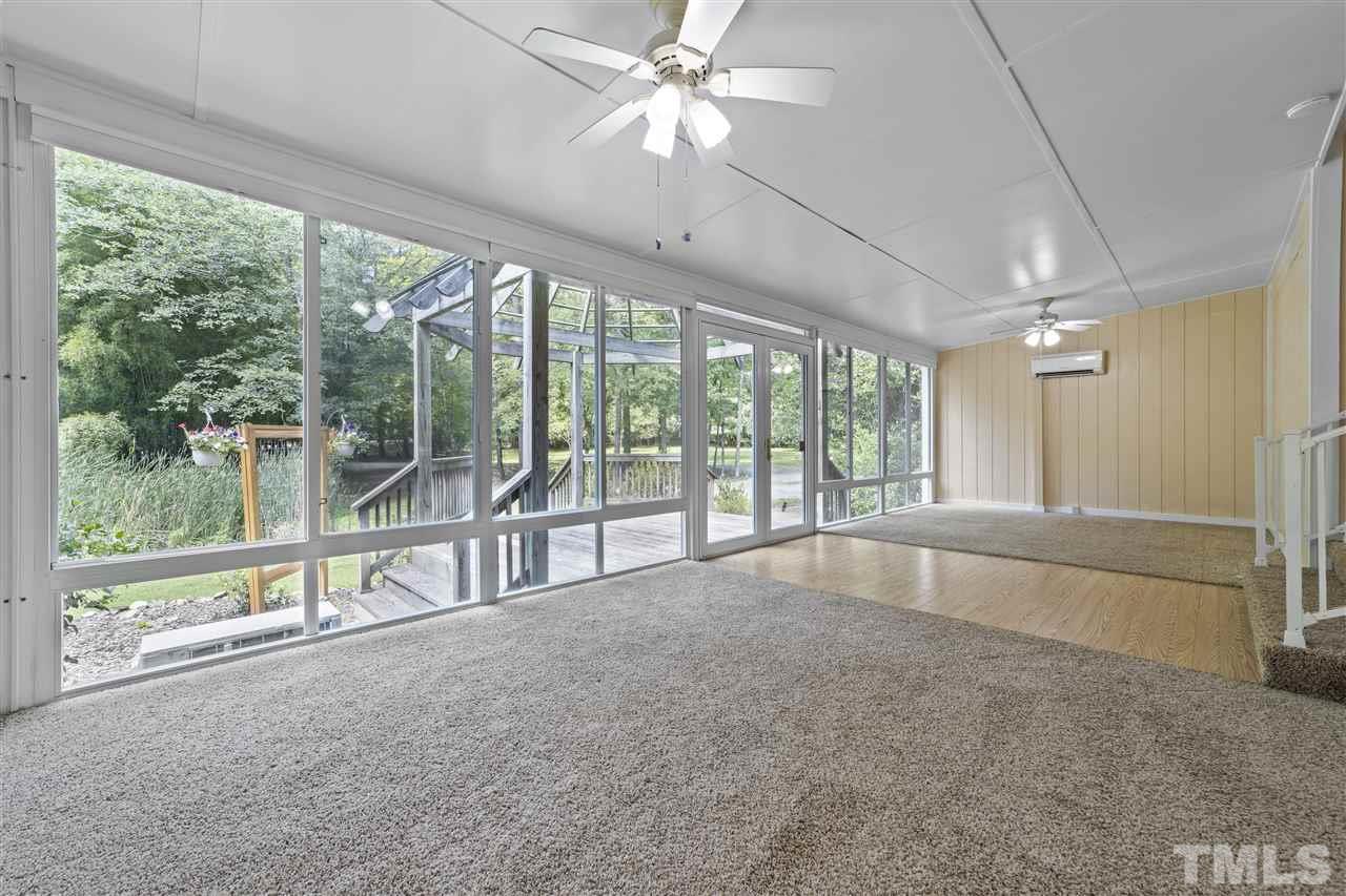 96 Silverberry Road Pittsboro, NC 27312 - Photo 6 of 30 Sunroom is terrific flex space--study, formal dining, or just a place to relax. Dual HVAC wall units keep it cool in summer and warm in winter.