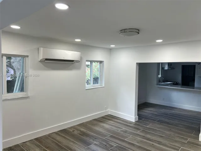 a view of a room that has a window in it