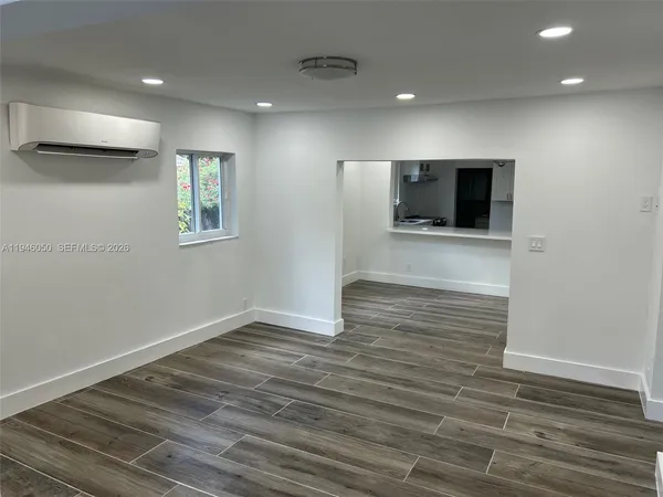 a view of hallway with wooden floor