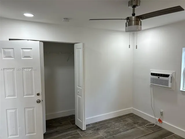 a view of a bathroom from a hallway