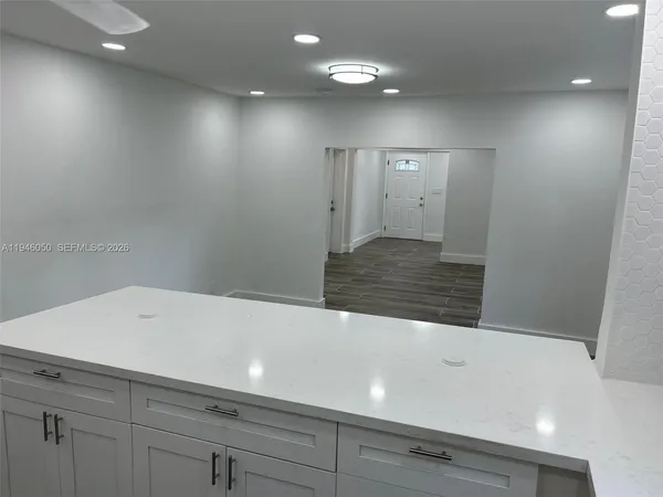 a view of a bathroom from a hallway
