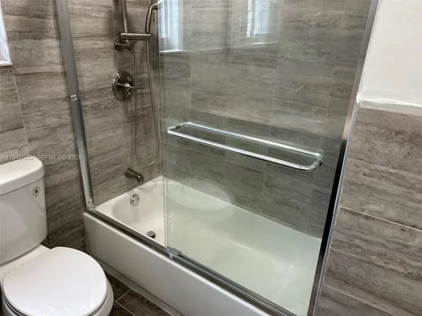 a view of front door with wooden floor