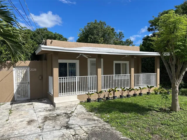 a view of balcony with wooden floor