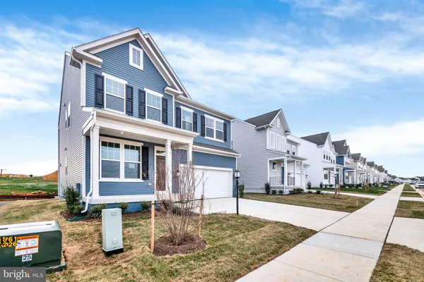 a house with yard in front of it