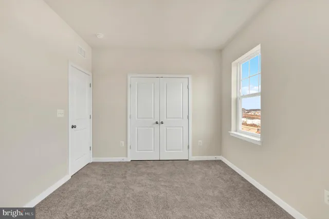 a view of an empty room and window