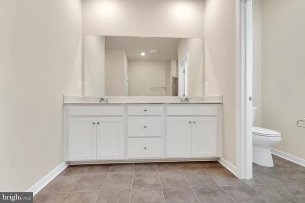 a view of a granite countertop cabinets