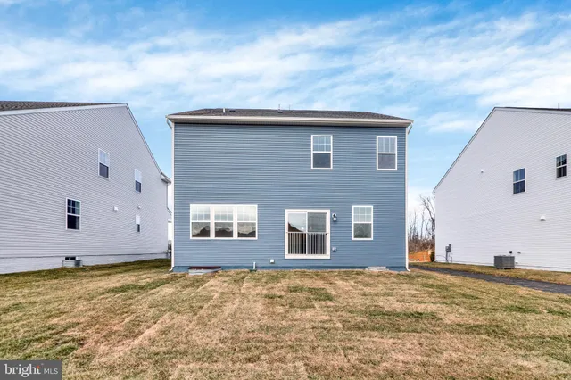 a house view with a backyard space