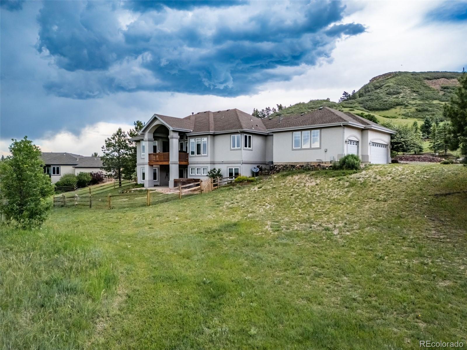 4612 High Spring Road Castle Rock, CO 80104 - Photo 44 of 50 a view of a house with a big yard plants and large trees