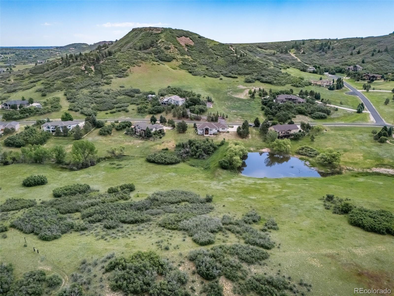 4612 High Spring Road Castle Rock, CO 80104 - Photo 48 of 50 a view of a lush green hillside and houses