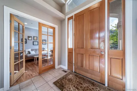 a view of a livingroom with furniture and front door